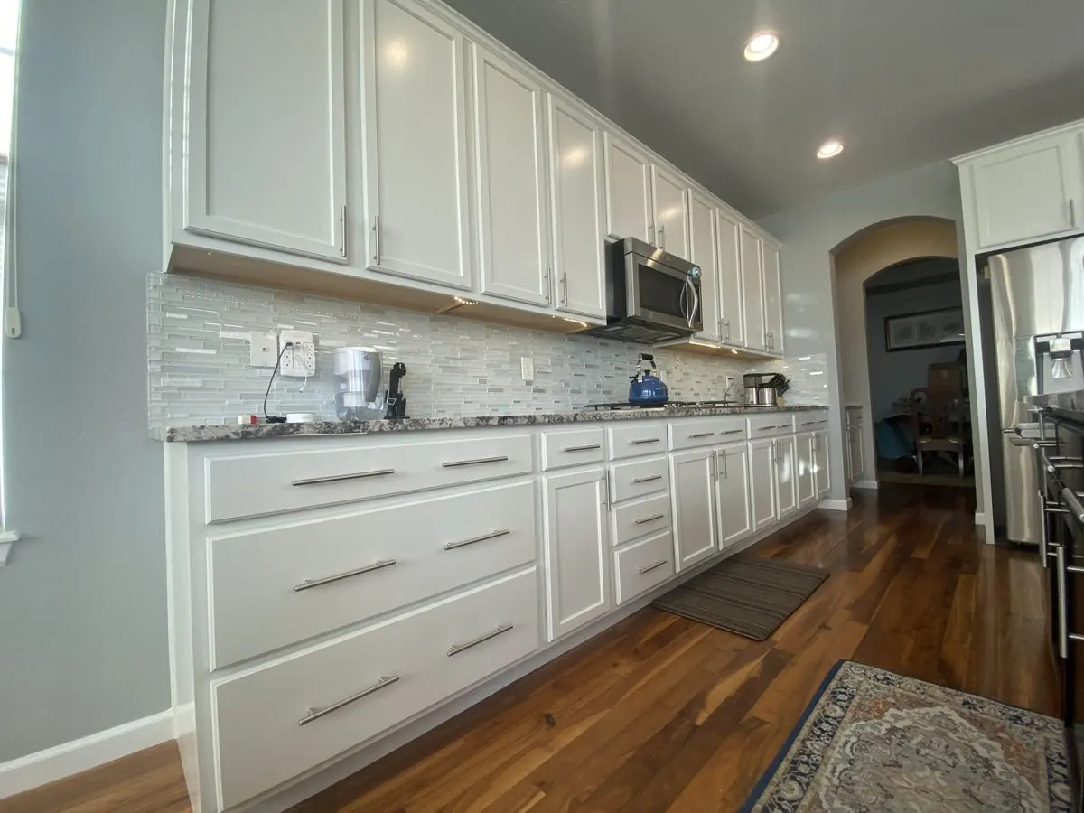 Long run of repainted cabinets with new hardware, Denver metro